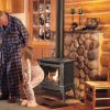 Grandfather and child warming up next to gas stove
