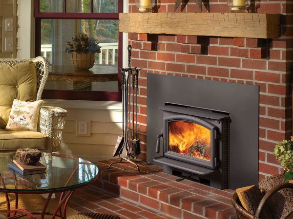 Wood fireplace insert with red brick mantel
